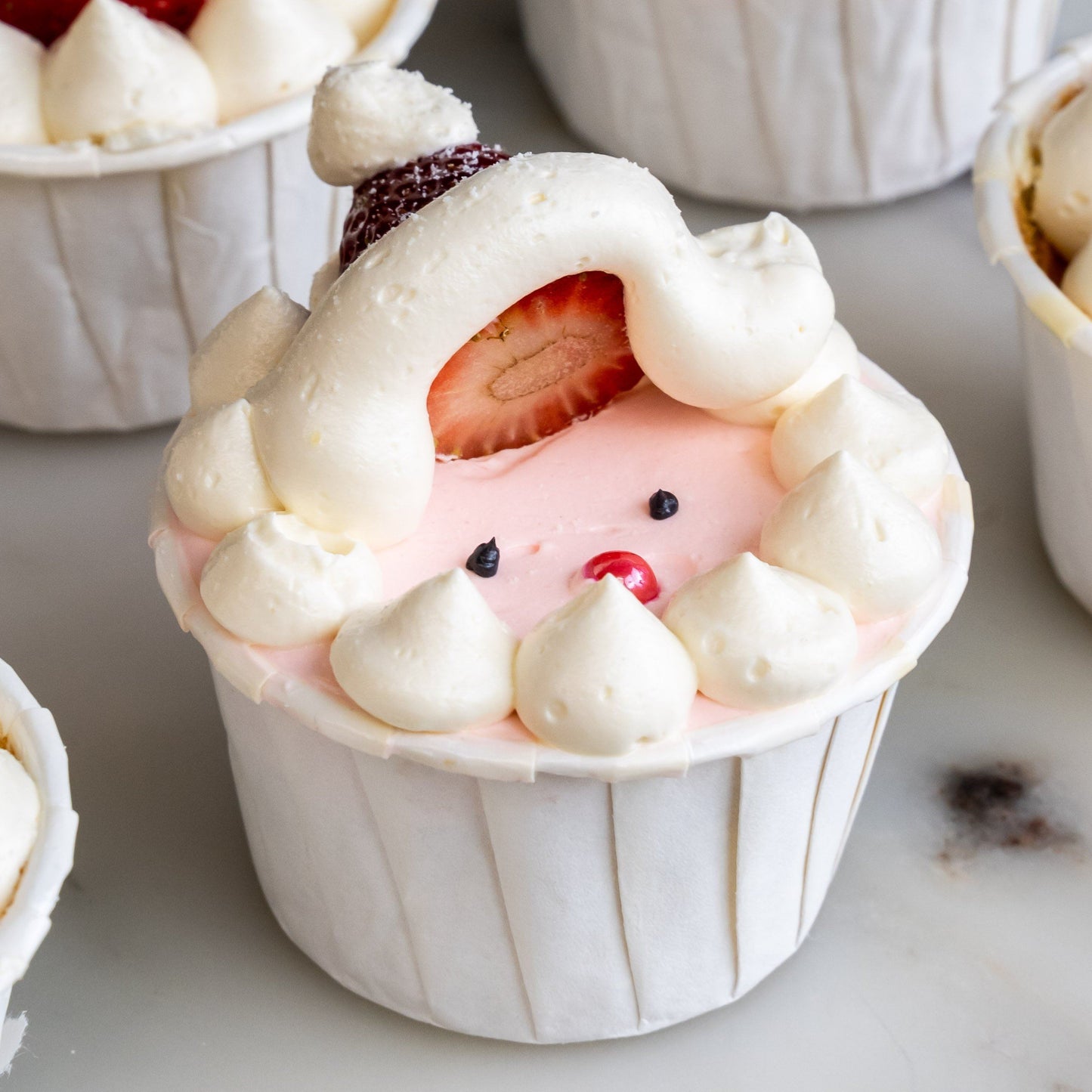 12 pieces of Strawberry Santa Christmas Cupcakes